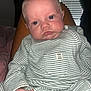 baby, infant, face, person, striped_clothing, onesie, hand, legs, indoor, window_blinds, curtains, red_eye, skin, expression, child, portrait, sitting, closeup, flash_photography, home