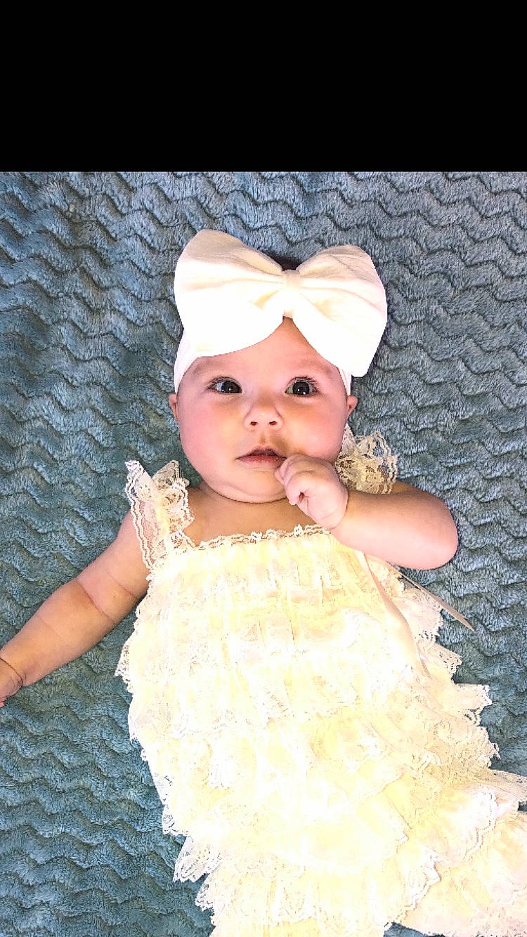 Adley joined the competition — help win amazing prizes! baby, child, clothing, costume_accessory, dress, fashion_accessory, hair_accessory, happy, headband, headgear, headpiece, headwear, person, photography, skin, smile, toddler, white, yellow