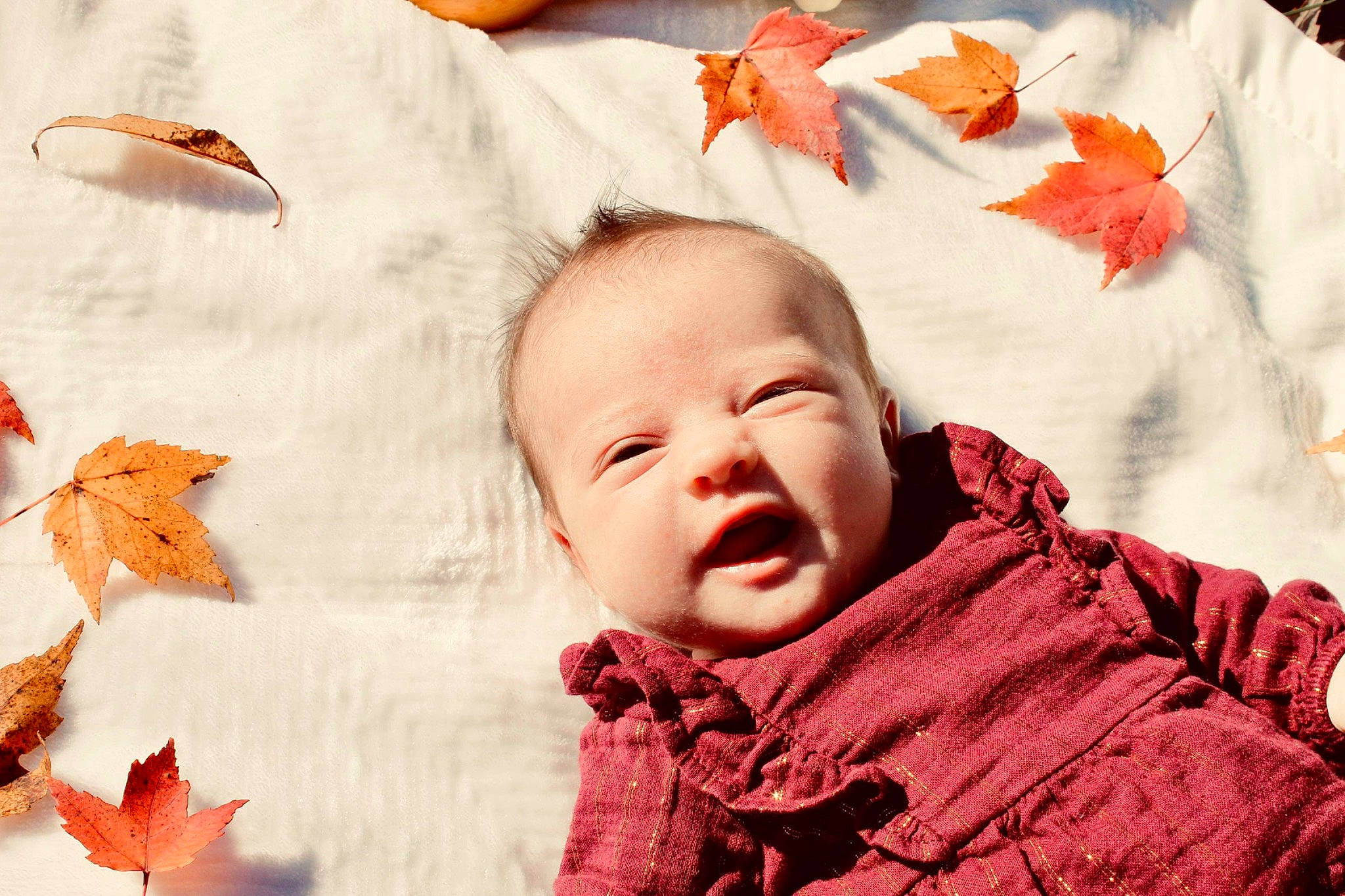 Emerson is registered to the contest to win money with this photo: baby, baby_toddler_clothing, cheek, child, comfort, event, happy, head, linens, mammal, orange, people_in_nature, person, red, skin, sleeve, smile, textile, toddler, vertebrate