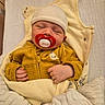 baby, bed, blanket, child, comfort, cozy, cute, hat, indoor, infant, nap, newborn, pacifier, resting, sleeping, small_hands, soft, wrapped, yellow_clothing, zipped_jacket