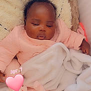 Zahra participe au concours pour gagner de l'argent avec cette photo : baby, sleeping, blanket, pink_clothing, cozy, infant, cute, heart_sticker, soft_texture, child, resting, indoors, portrait, wrapped, peaceful, adorable, newborn, warm, toddler, face