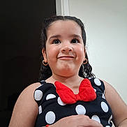 Monserrat joined the competition — help win amazing prizes! black_dress, bracelet, casual, child, curly_hair, cute, earrings, face, fashion, girl, hand, happy, indoor, person, playful_expression, polka_dot, portrait, red_bow, smile, young
