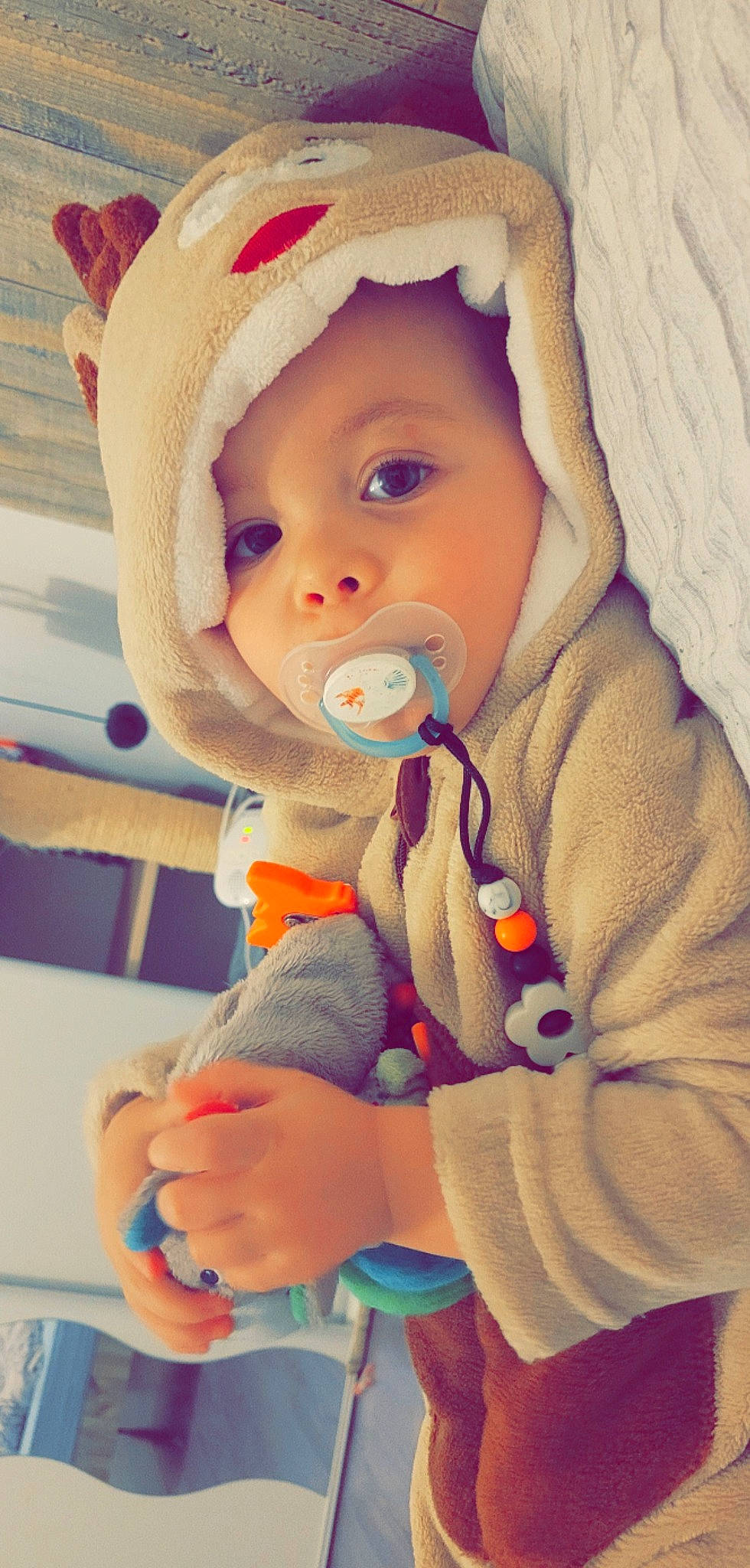 Mayron participe au concours pour gagner de l'argent avec cette photo : baby, baby_products, baby_safety, baby_sleeping, baby_toddler_clothing, blue, cap, cheek, child, comfort, face, finger, headwear, lip, mouth, person, sitting, skin, sleeve, textile