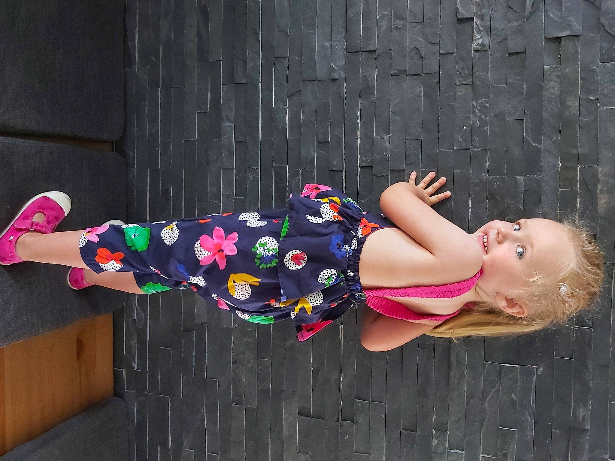 Emmy participe au concours pour gagner de l'argent avec cette photo : child, costume, eyewear, happy, high_heels, human_body, human_leg, knee, leg, magenta, pattern, person, pink, purple, sandal, sitting, street_fashion, textile, thigh, waist