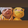newborn, baby, infant, child, portrait, sleepy, white_hat, plush_toy, lion, stuffed_animal, yellow, cuddling, close_up, face, indoors, warm_lighting, onesie, infant_clothing, photography, cozy
