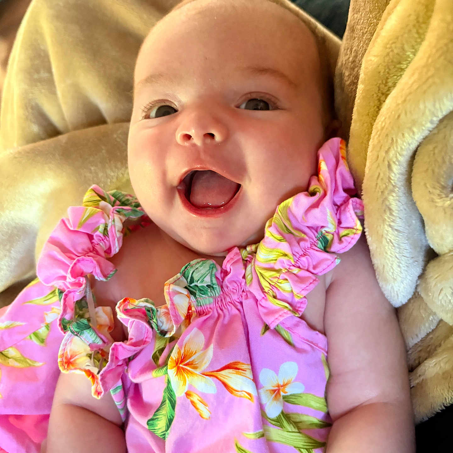 Arabella joined the competition — help win amazing prizes! arm, baby, blanket, candid, cheerful, child, closeup, comfortable, cute, eyes, face, floral_pattern, happy, indoors, infant, pink_clothing, portrait, skin, smiling, soft_texture