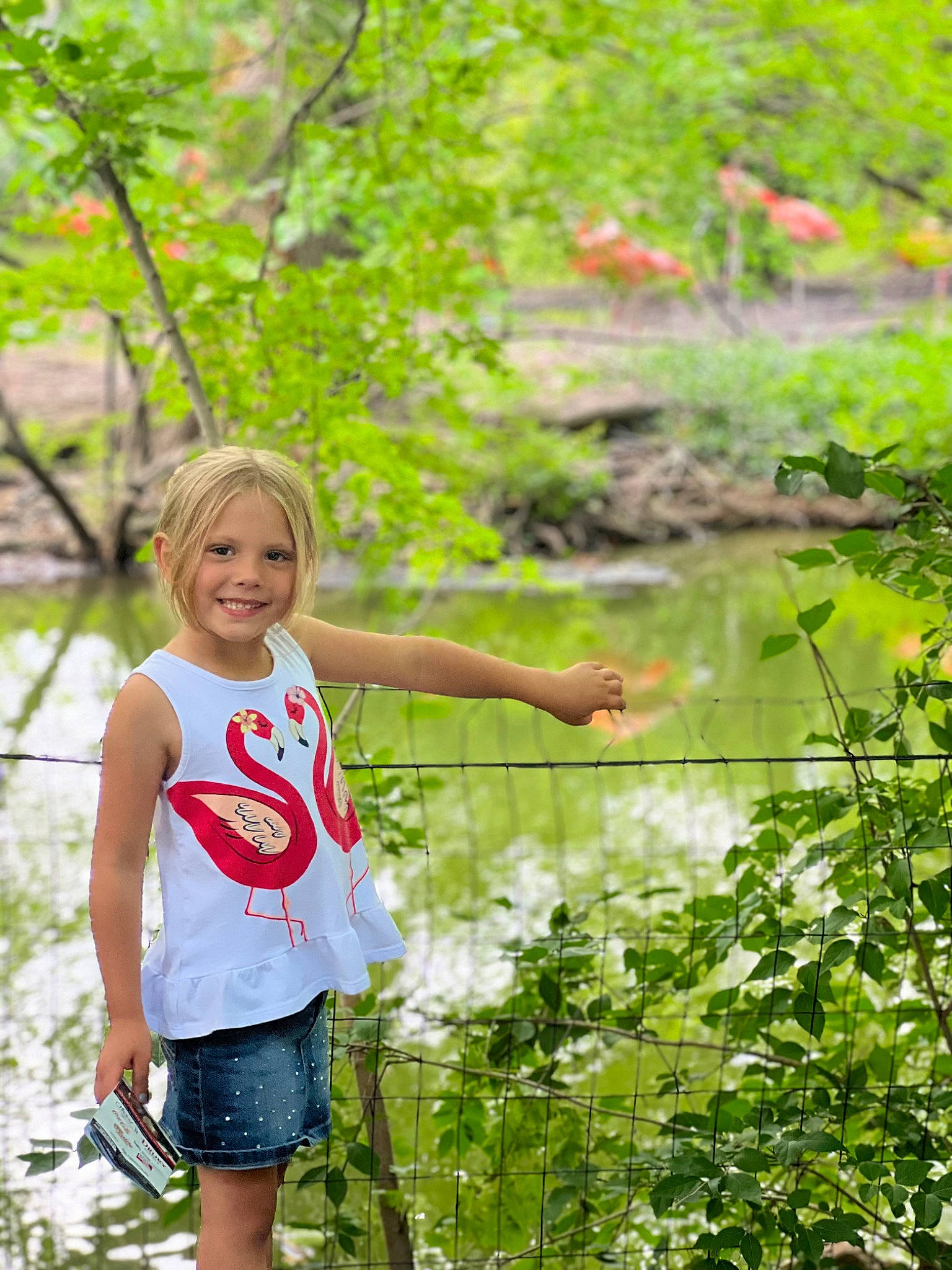 Izzy is registered to the contest to win money with this photo: botany, forest, grass, happy, joy, jungle, lake, leaf, leisure, natural_landscape, nature, people_in_nature, person, plant, recreation, shorts, smile, summer, t_shirt, tree