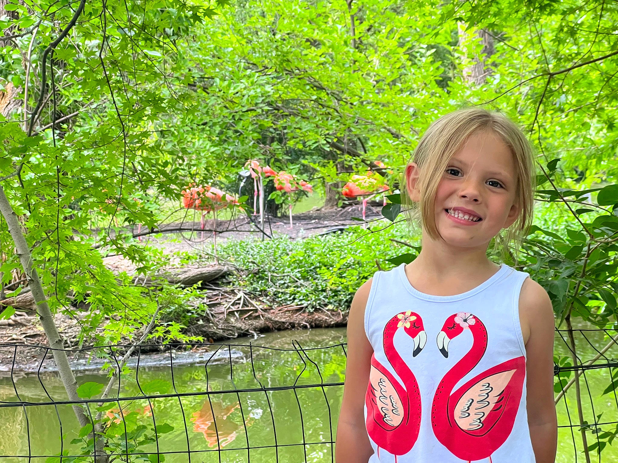 Izzy joined the competition — help win amazing prizes! botany, flower, grass, green, happy, joy, leaf, leisure, natural_environment, natural_landscape, nature, people_in_nature, person, plant, shrub, sleeve, smile, terrestrial_plant, toddler, tree