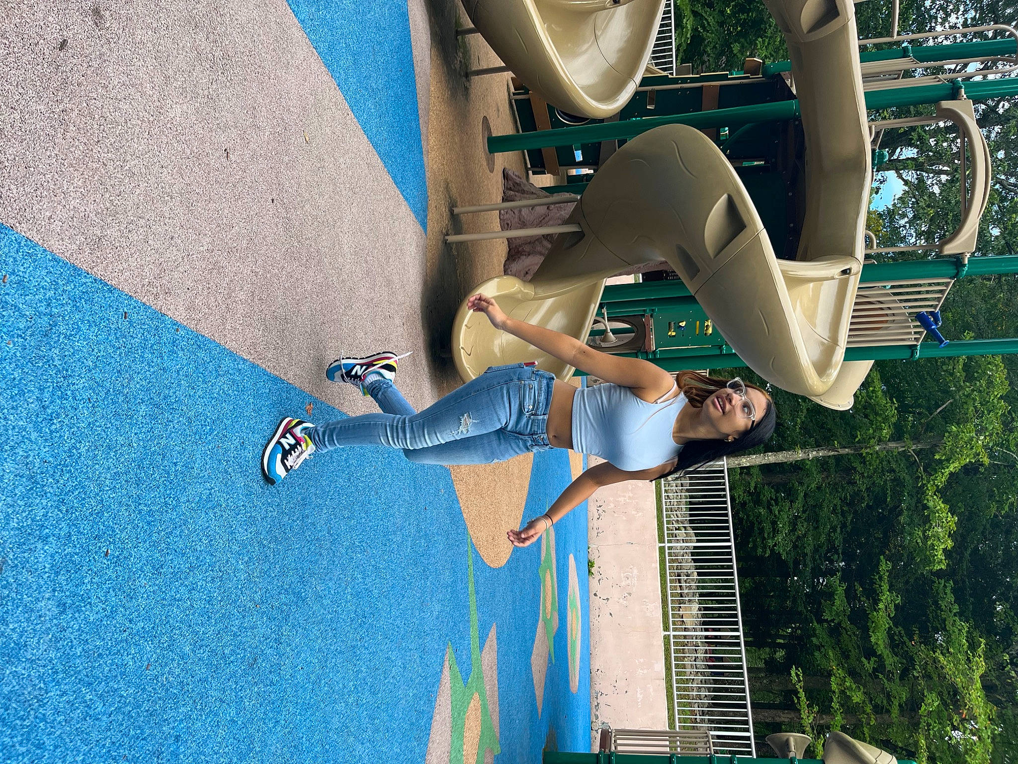 Julie is registered to the contest to win money with this photo: adventure, blue, electric_blue, extreme_sport, fun, human_leg, joy, leisure, line, person, recreation, shorts, sky, sports, tree, vehicle_door