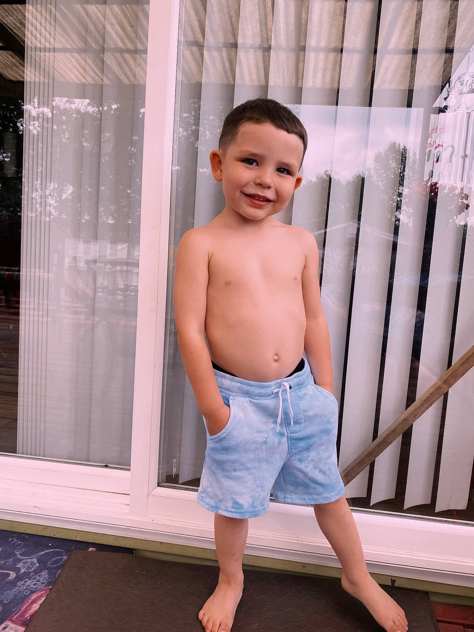 Anthony is registered to the contest to win money with this photo: barefoot, board_short, chest, child, denim, fashion, happy, human_leg, joy, knee, person, shorts, sleeve, smile, standing, stomach, t_shirt, textile, thigh, trunk