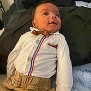 Zaedyn joined the competition — help win amazing prizes! baby, infant, child, clothing, shirt, pants, bed, blanket, pillow, face, smile, looking_up, cute, indoors, soft_texture, young_child, portrait, person, happy, casual