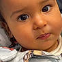 Naïm participe au concours pour gagner de l'argent avec cette photo : baby, cheeks, child, close_up, clothing, curious, cute, expression, eyes, face, indoor, jacket, pattern, person, portrait, skin, toddler, warm_clothing, young, zipper