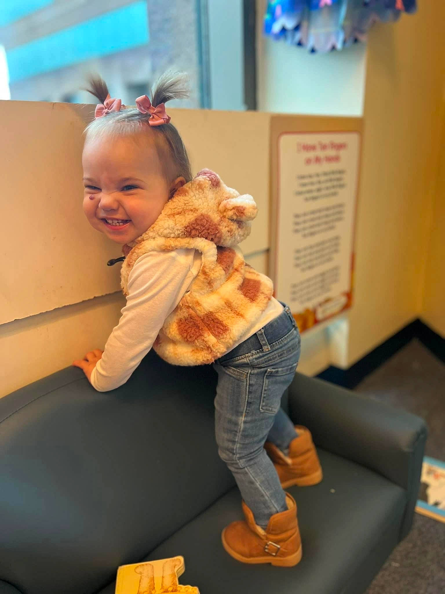 Ryder joined the competition — help win amazing prizes! blond, blue, child, comfort, companion_dog, couch, flooring, fun, fur, happy, human_leg, joy, knee, leisure, orange, person, sitting, skin, smile, thigh