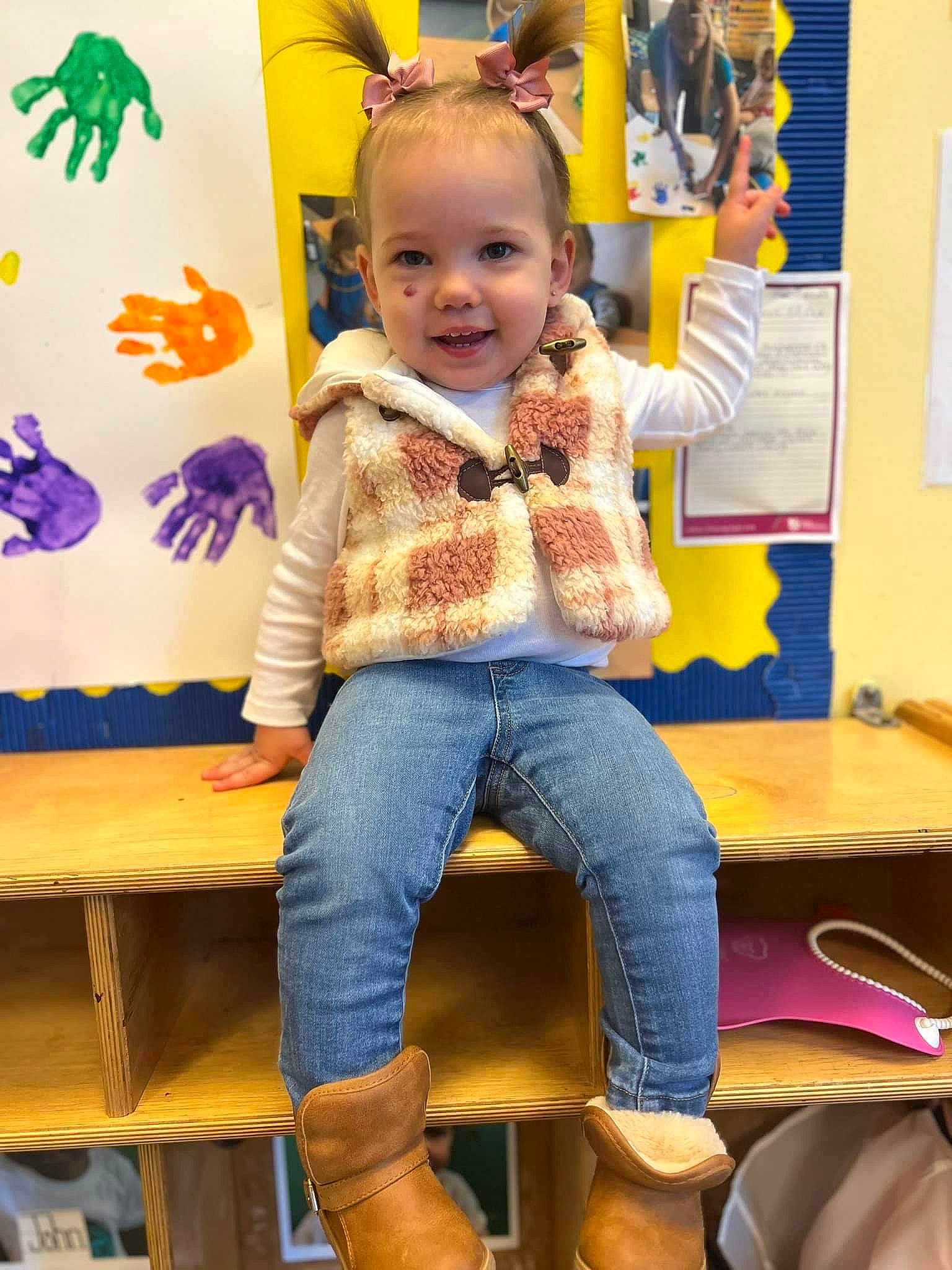 Ryder is registered to the contest to win money with this photo: blue, chair, child, denim, event, fun, happy, jeans, joy, kindergarten, leisure, pattern, person, room, sitting, smile, standing, t_shirt, table, toddler