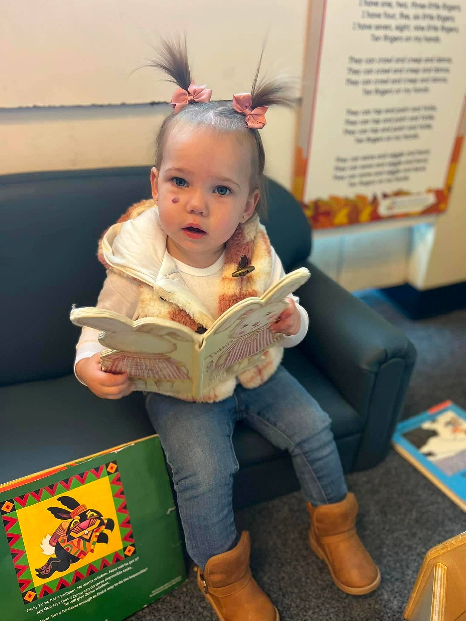 Ryder is registered to the contest to win money with this photo: baby, chair, child, flooring, fun, hair_tie, happy, headband, learning, leisure, person, reading, room, sitting, sock, toddler