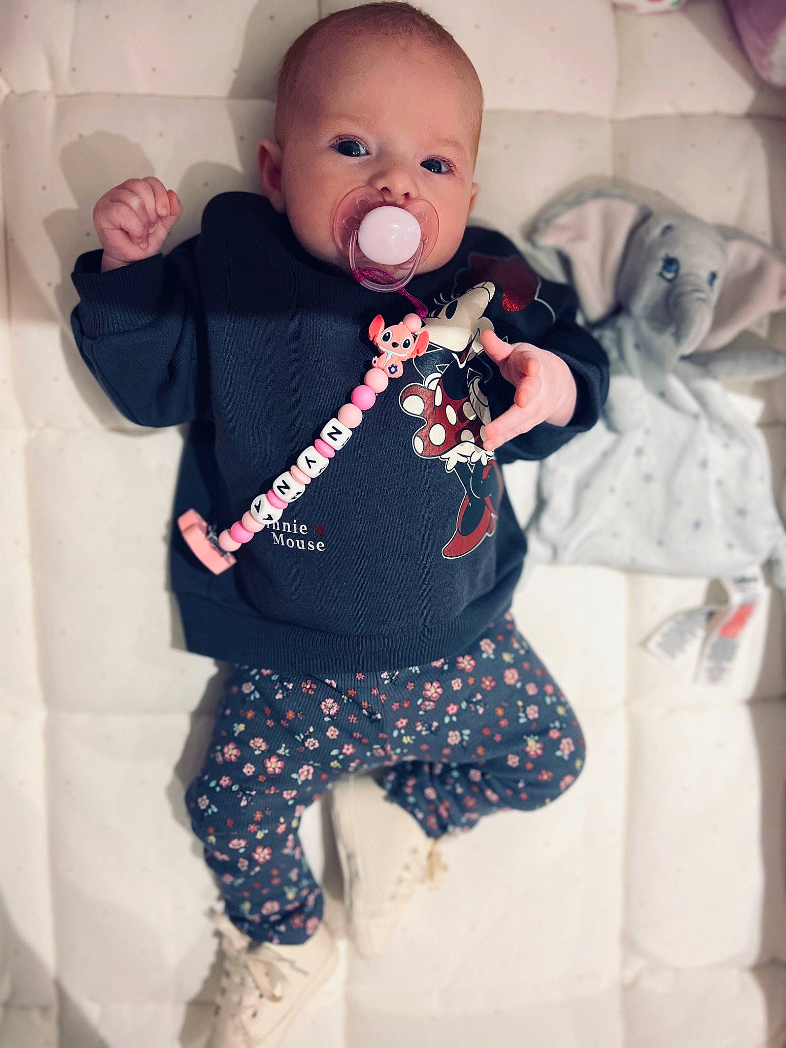 Nyna a rejoint le concours — aidez-le/la à gagner de superbes lots ! baby, baby_products, baby_toddler_clothing, cheek, child, electric_blue, facial_expression, fun, happy, magenta, neck, pattern, person, pink, sleeve, t_shirt, textile, thigh, toddler, trunk