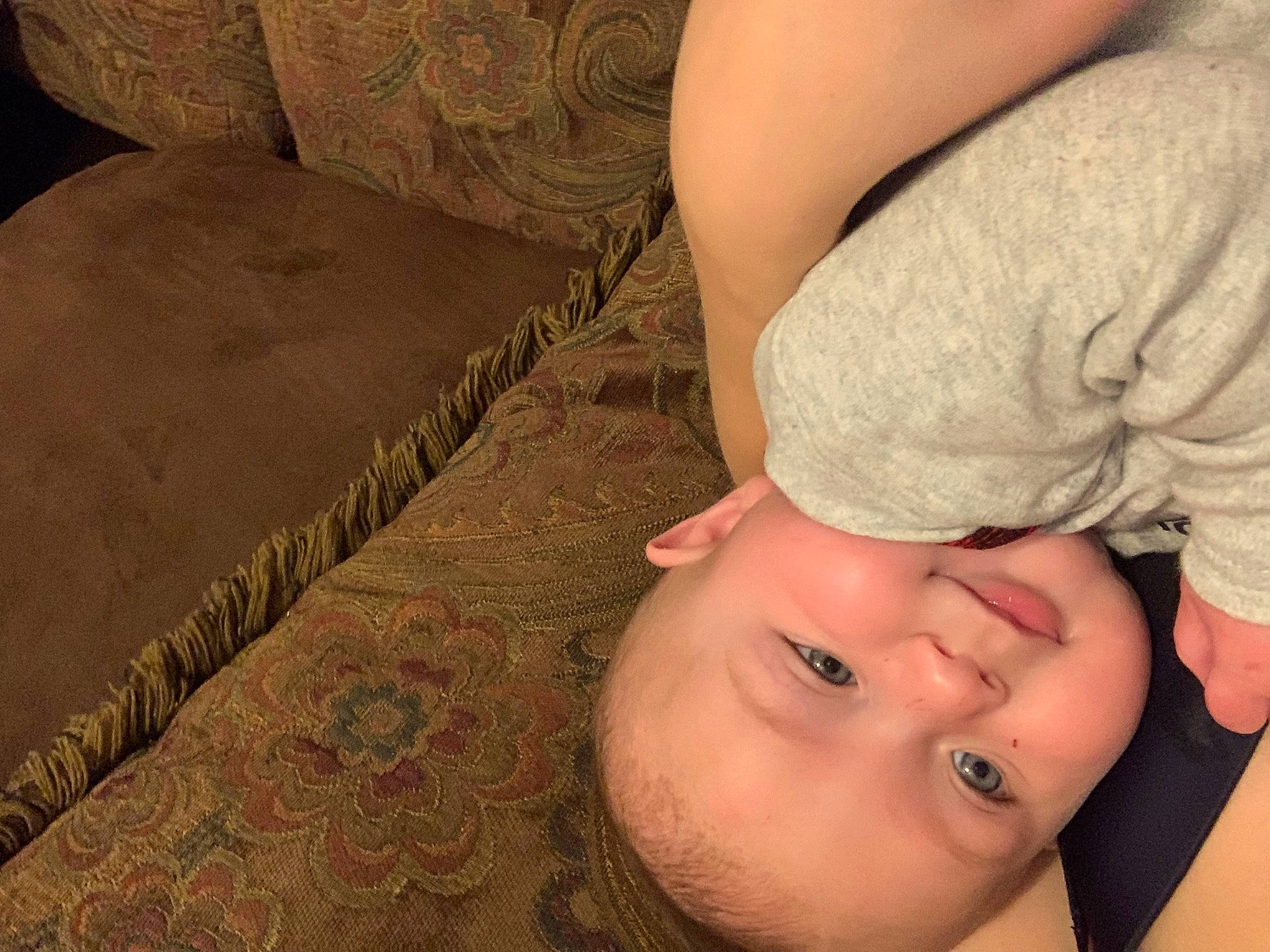 Coleson is registered to the contest to win money with this photo: baby, baby_toddler_clothing, chest, child, comfort, couch, elbow, flooring, gesture, happy, human_leg, linens, lip, mouth, muscle, nail, pattern, person, skin, toddler