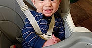 Connor joined the competition — help win amazing prizes! baby, blue_clothing, can, child, coffee_can, cute, face, furniture, happy, heater, high_chair, home, indoor, infant, person, safety_strap, seat, smile, table, wood_floor