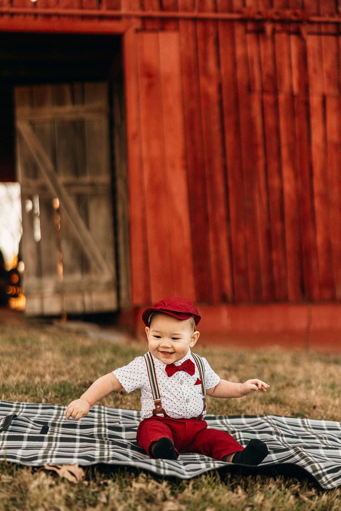 Colson is registered to the contest to win money with this photo: child, flash_photography, fun, grass, happy, headwear, human_leg, joy, landscape, lawn, leisure, people_in_nature, person, plucked_string_instruments, portrait_photography, sitting, soil, street, string_instrument, sunlight