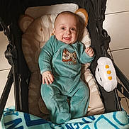 Ayden participe au concours pour gagner de l'argent avec cette photo : baby, infant, stroller, blanket, pajamas, smile, toy, tiled_floor, seat, portrait, indoor, happy, hand, eyes, head, cute, clothing, plush, person, baby_blanket