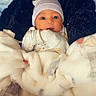 Naisaiah joined the competition — help win amazing prizes! baby, blanket, hat, face, infant, cozy, cute, wrapped, clothing, warm, bed, lying_down, soft, newborn, person, portrait, indoors, baby_clothes, gloves, expression