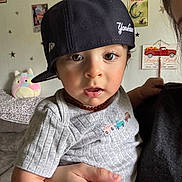 Julian joined the competition — help win amazing prizes! toddler, child, baby, cap, hat, face, person, indoor, wall, poster, stars, hand, clothing, cute, expression, eyelashes, toy, plush, furniture, decor