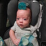 baby, infant, pacifier, car_seat, blanket, striped_clothing, child, cute, indoors, portrait, person, newborn, soft_toys, resting, comfort, young_child, head_support, cozy, small_hands, expression