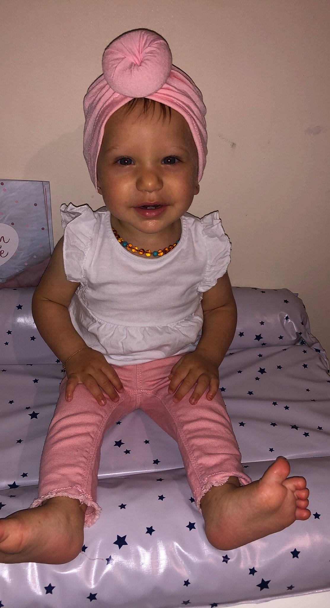 Elyana participe au concours pour gagner de l'argent avec cette photo : baby_toddler_clothing, cheek, dress, facial_expression, happy, head, headwear, human_body, joy, leg, lip, mouth, neck, person, pink, purple, skin, sleeve, smile, standing