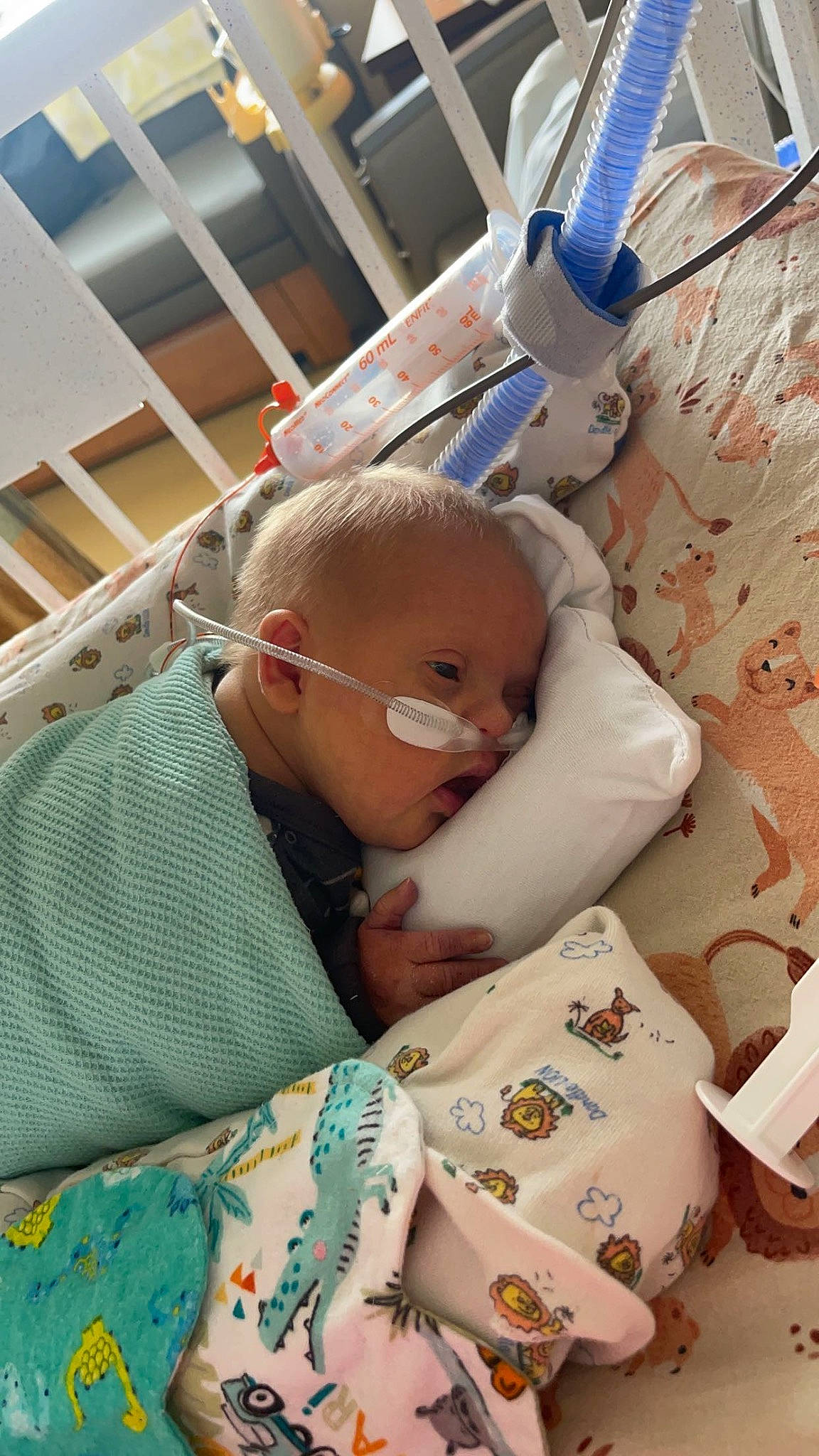 Colt is registered to the contest to win money with this photo: baby, baby_products, baby_sleeping, baby_toddler_clothing, bedding, bedtime, child, comfort, eyewear, glasses, linens, nap, pattern, person, plastic_bottle, room, service, sleep, toddler, water_bottle