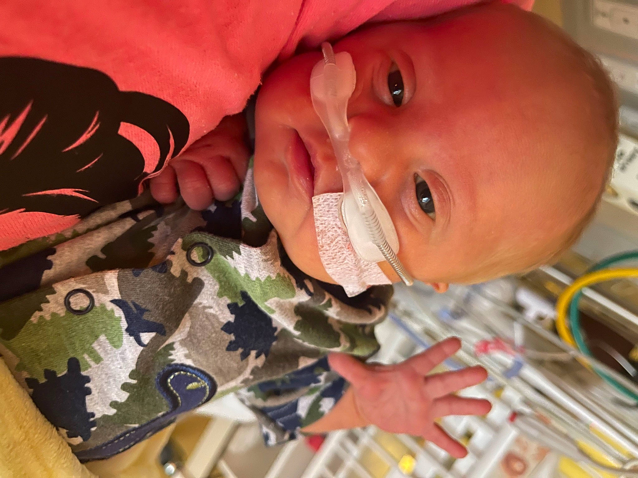 Colt is registered to the contest to win money with this photo: baby, baby_products, baby_toddler_clothing, cheek, child, ear, eye, eyelash, finger, gesture, happy, iris, military_camouflage, mouth, neck, nose, person, skin, sleeve, smile