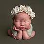 Orlagh is registered to the contest to win money with this photo: newborn, baby, flower_crown, sleeping, hands, chin, soft_wrap, portrait, infant, cute, peaceful, studio, pose, headwear, skin, tiny, closed_eyes, resting, adorable, child