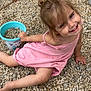 barefoot, bucket, casual, child, cute, daylight, face, fun, girl, gravel, hair, happy, kid, outdoor, person, pink_dress, play, sitting, smiling, toy