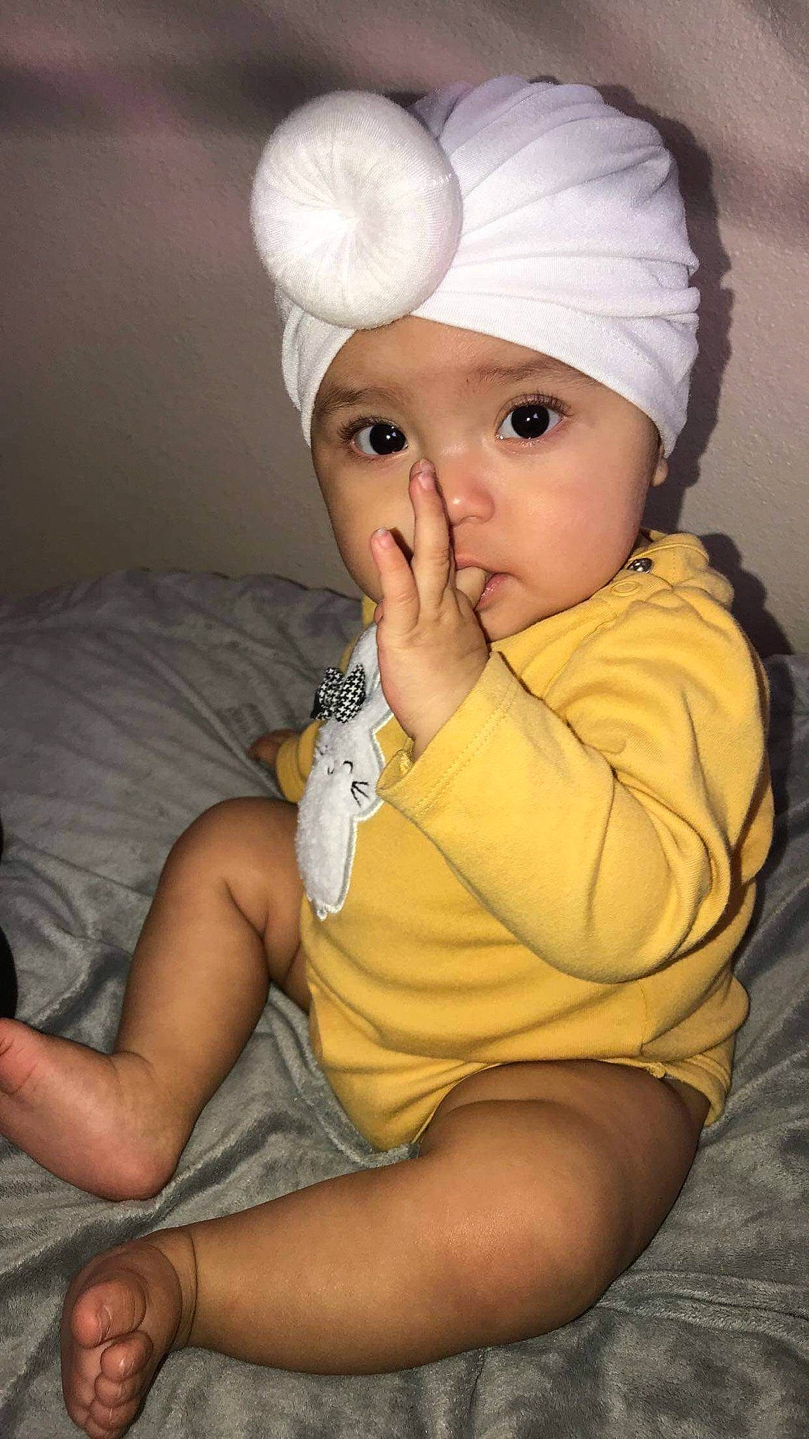 Izabell joined the competition — help win amazing prizes! baby, cap, cheek, child, eye, headgear, headwear, nose, person, sitting, skin, smile, toddler, yellow