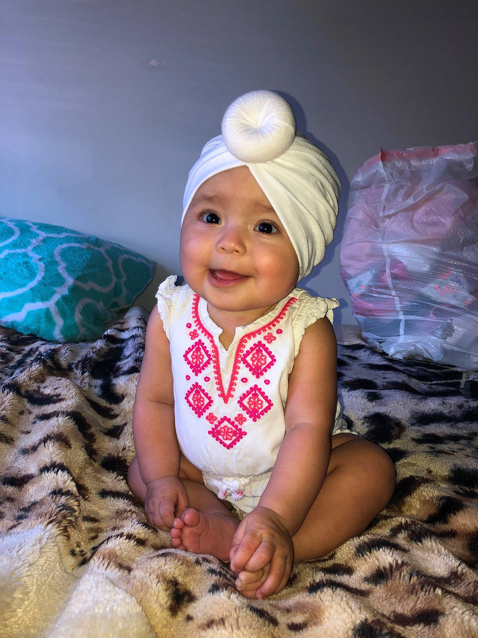 Izabell is registered to the contest to win money with this photo: baby, child, headgear, headwear, joy, person, sitting, smile, toddler