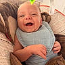 Levi joined the competition — help win amazing prizes! baby, smile, bib, cushion, seat, toy, hand, face, infant, comfort, pattern, clothing, indoor, happy, child, closeup, skin, expression, cute, babywear