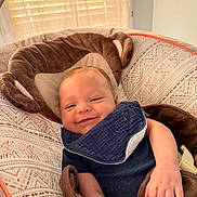 Levi joined the competition — help win amazing prizes! baby, infant, smiling, bib, baby_seat, comfort, indoor, patterned_fabric, child, happy, face, cute, relaxed, clothing, arm, hand, seatbelt, soft_toys, window, daylight