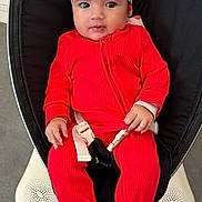 Belsame participe au concours pour gagner de l'argent avec cette photo : baby, infant, red_onesie, headband, strawberry_pattern, baby_rocker, buckle, indoor, floor, slippers, curious, seated, clothing, child, person, cute, portrait, hands, footwear, carpet
