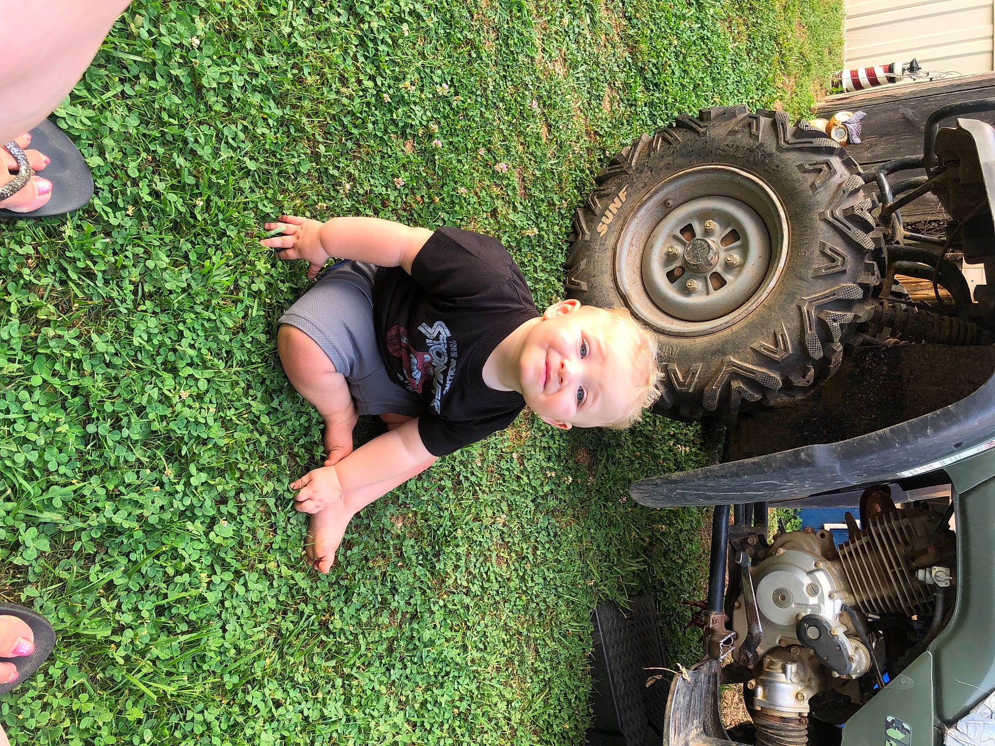 Axl joined the competition — help win amazing prizes! alloy_wheel, automotive_design, automotive_exterior, automotive_lighting, automotive_tire, bumper, car, fender, grass, green, hood, motor_vehicle, person, plant, smile, synthetic_rubber, tire, tread, vehicle, vehicle_door