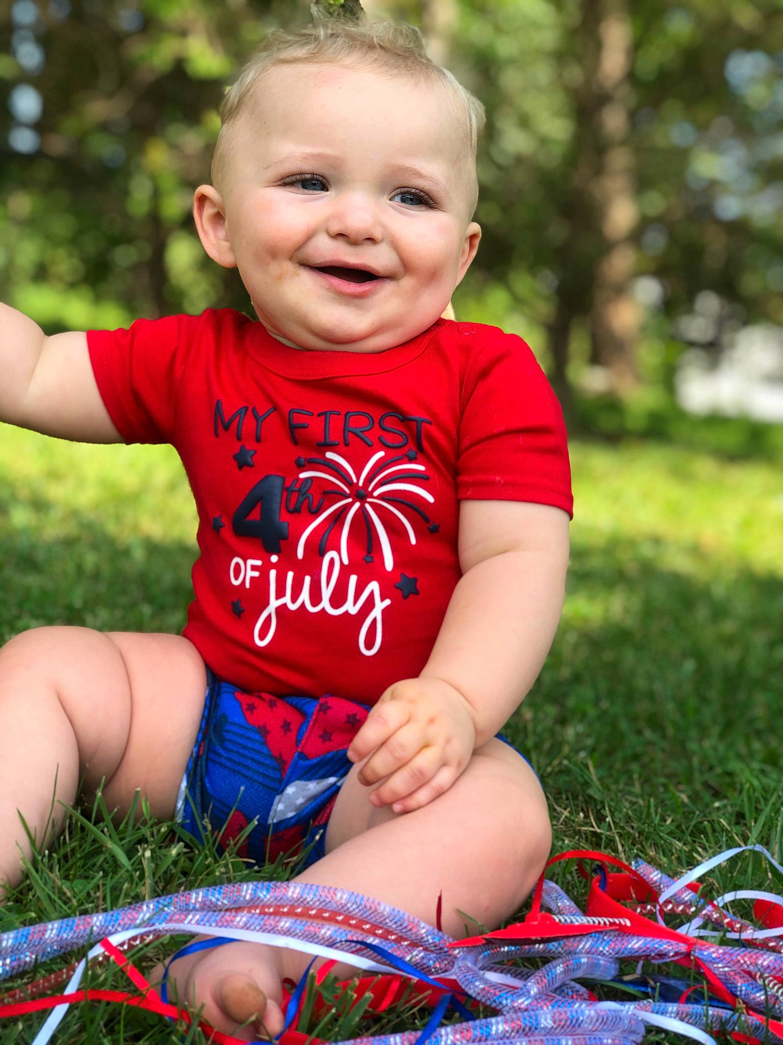 Axl joined the competition — help win amazing prizes! baby_toddler_clothing, eye, face, facial_expression, finger, fun, grass, happy, head, joy, leg, leisure, people_in_nature, person, pink, plant, skin, smile, sunlight, t_shirt