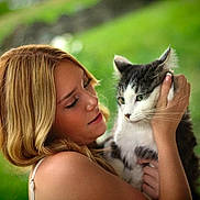 Herman joined the competition — help win amazing prizes! woman, cat, pet, outdoor, greenery, portrait, animal, human, blonde_hair, holding, affection, nature, face, fur, whiskers, closeup, gentle, love, person, daylight