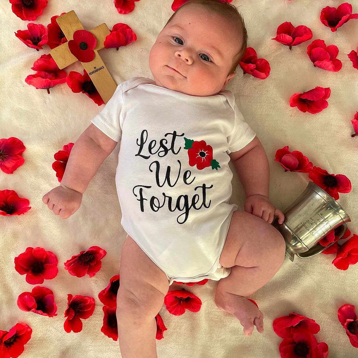 Danny joined the competition — help win amazing prizes! baby, blanket, child, commemoration, cross, cute, flower, hands, infant, legs, lying_down, memorial, onesie, peaceful, portrait, red_poppy, remembrance, silver_cup, skin, soft_texture