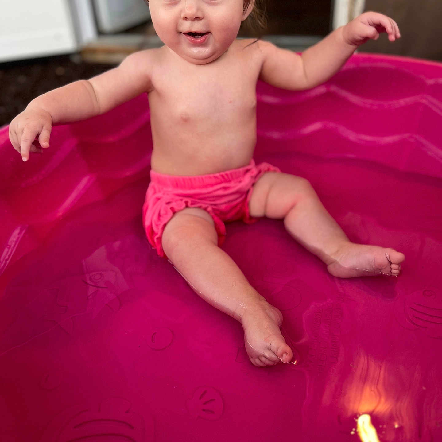 Isabella joined the competition — help win amazing prizes! baby, barefoot, child, cute, daylight, fun, happy, joy, outdoor, pink, play, pool, shorts, sitting, skin, smiling, splashing, summer, toddler, water