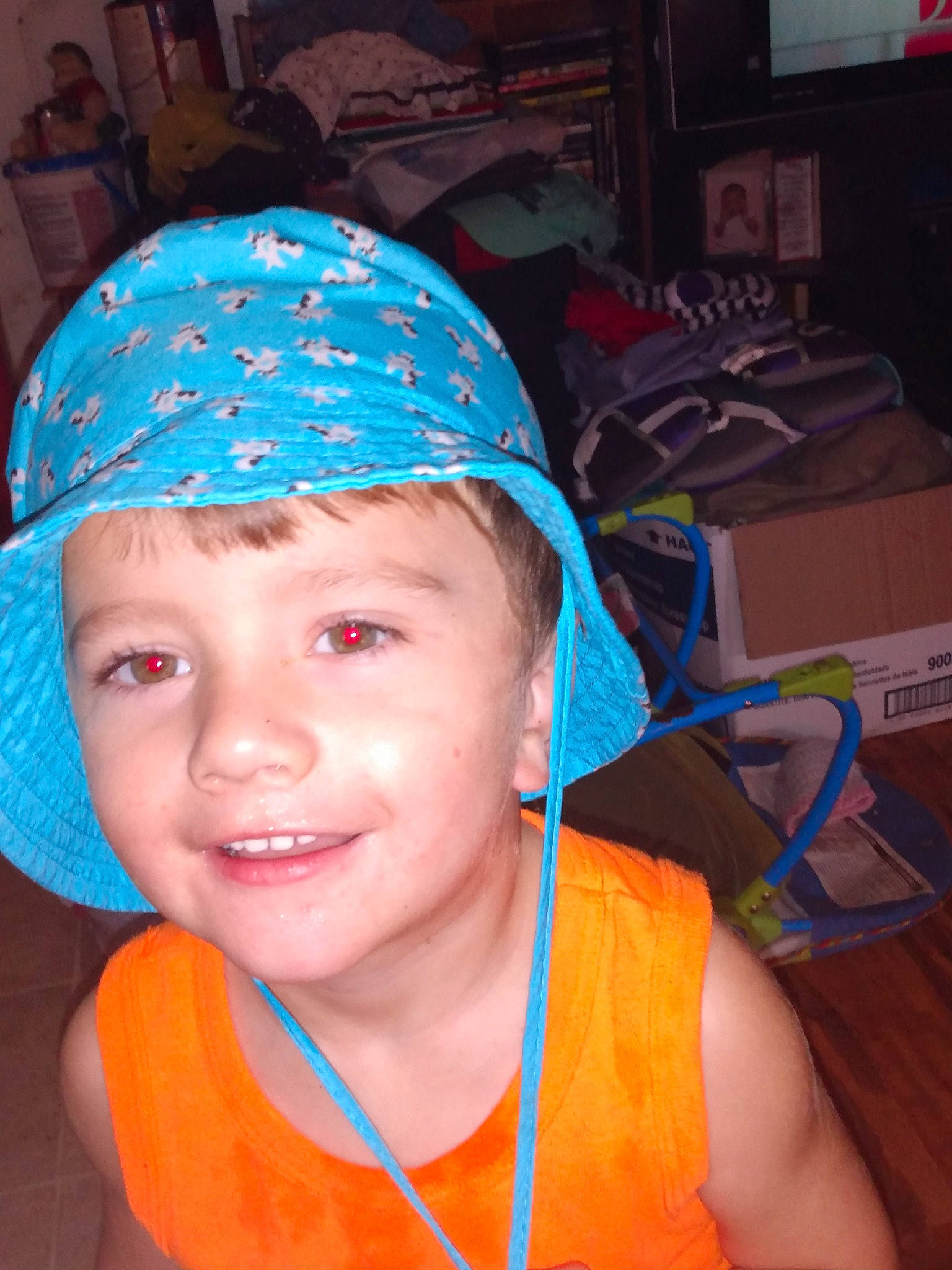 Taysom is registered to the contest to win money with this photo: cap, child, chin, electric_blue, eye, eyebrow, forehead, fun, happy, headgear, headwear, joy, leisure, mouth, neck, nose, orange, person, personal_protective_equipment, smile