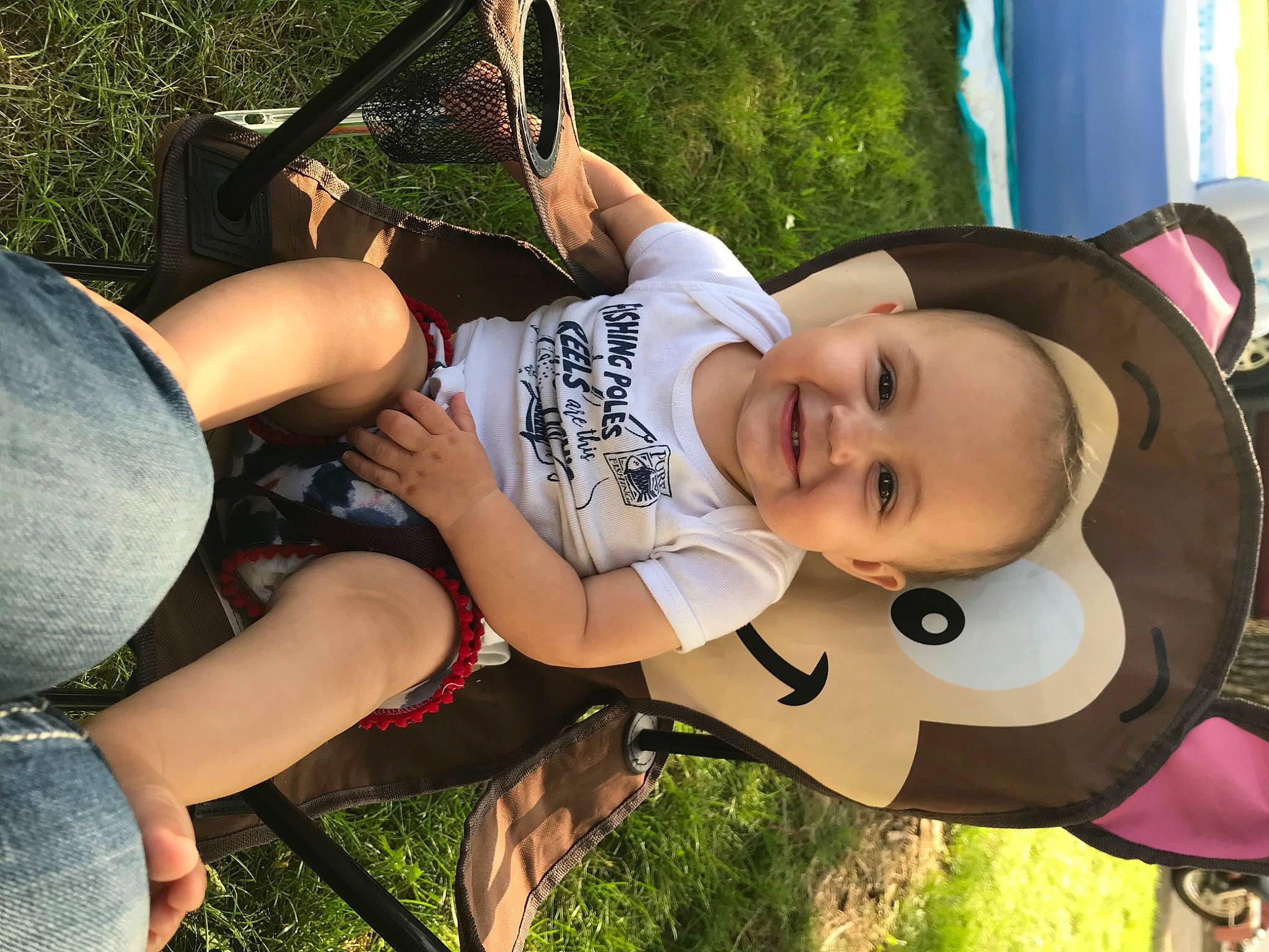 Marleigh joined the competition — help win amazing prizes! baby, child, cool, fun, grass, happy, hat, headgear, human_leg, joy, leisure, person, plant, recreation, shorts, sitting, smile, sun_hat, thigh, toddler