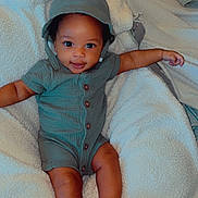 Klover is registered to the contest to win money with this photo: baby, infant, child, romper, hood, sandals, blanket, smile, cute, adorable, skin, eyes, face, legs, feet, clothing, fabric, comfort, portrait, indoor