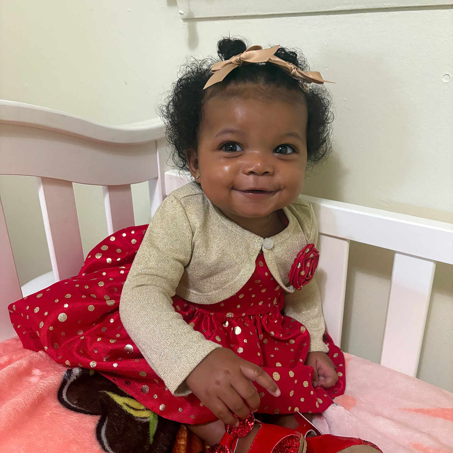 Charlie is registered to the contest to win money with this photo: bodypart, child, clothing, couch, crib, dress, face, female, finger, footwear, furniture, girl, hand, head, infantbed, person, photography, portrait, shoe, sitting