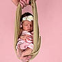 Lou participe au concours pour gagner de l'argent avec cette photo : newborn, baby, sleeping, pink_background, floral_headband, wrapped_in_cloth, hands, beige_sling, portrait, infant, cute, peaceful, soft_lighting, studio_photo, human, skin, small_feet, delicate, tender, resting