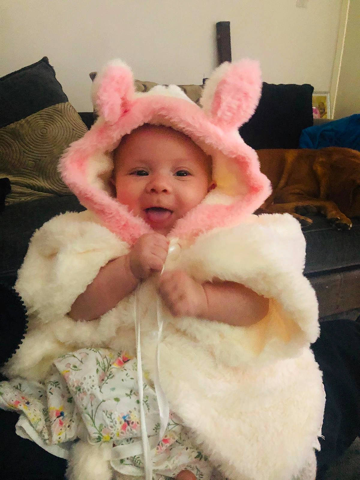 Olivia joined the competition — help win amazing prizes! arm, baby, baby_toddler_clothing, cap, cheek, eye, finger, fur_clothing, hand, hat, head, headwear, human_body, jacket, lip, natural_material, person, pink, skin, sleeve