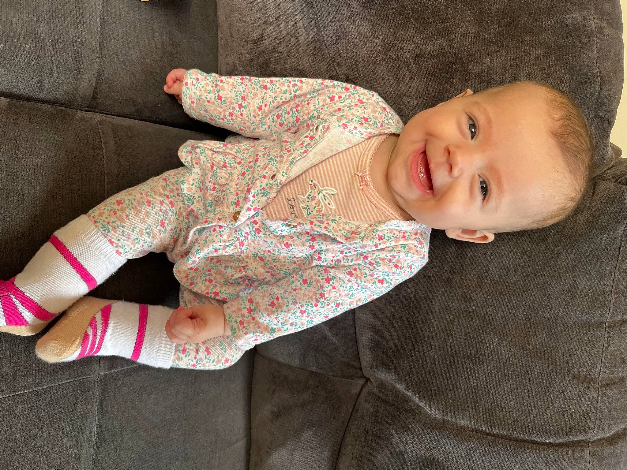 Mila joined the competition — help win amazing prizes! arm, baby_toddler_clothing, comfort, couch, dress, elbow, eye, face, human_body, human_leg, joy, linens, lip, neck, pattern, person, skin, sleeve, smile, textile