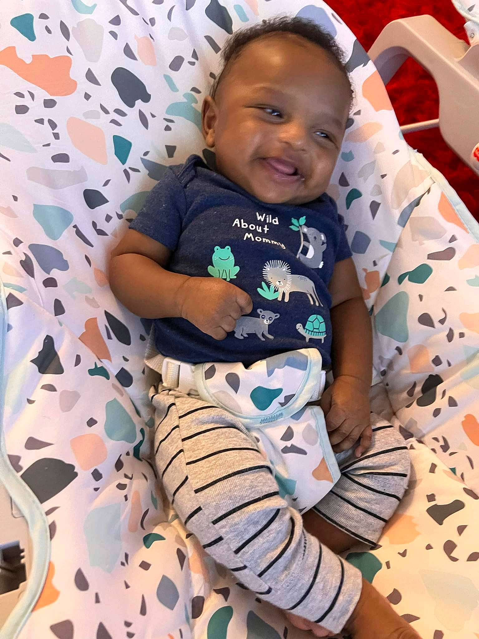 Craig is registered to the contest to win money with this photo: baby_toddler_clothing, child, comfort, face, facial_expression, finger, fun, hairstyle, happy, head, human, linens, person, product, skin, sleeve, smile, t_shirt, textile, thigh